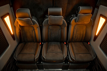 Comfortable interior of a passenger bus with soft seats