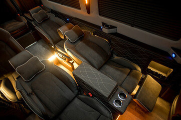 Comfortable interior of a passenger bus with soft seats