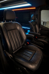 Comfortable interior of a passenger bus with soft seats