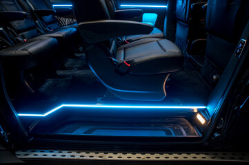 Comfortable interior of a passenger bus with soft seats