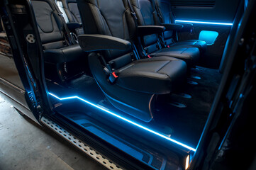 Comfortable interior of a passenger bus with soft seats