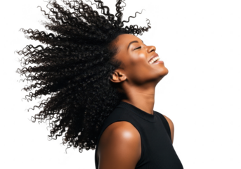 Joyful woman with long flowing hair smiling upwards against a black backdrop transparent background