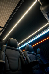 Comfortable interior of a passenger bus with soft seats