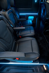 Comfortable interior of a passenger bus with soft seats