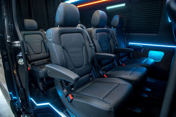 Comfortable interior of a passenger bus with soft seats
