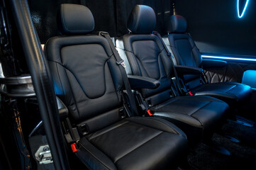Comfortable interior of a passenger bus with soft seats