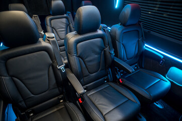 Comfortable interior of a passenger bus with soft seats