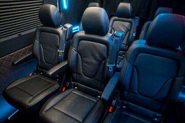 Comfortable interior of a passenger bus with soft seats
