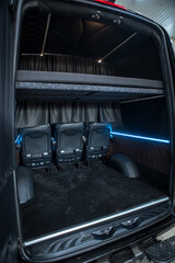 Comfortable interior of a passenger bus with soft seats