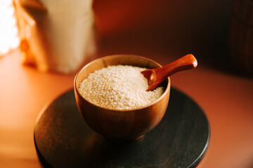 Couscous in a wooden bowl ready for cooking in a cozy kitchen setting