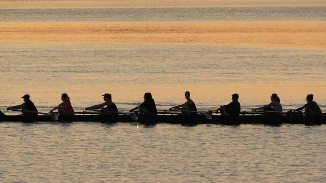 Female Rowing Team on Lake