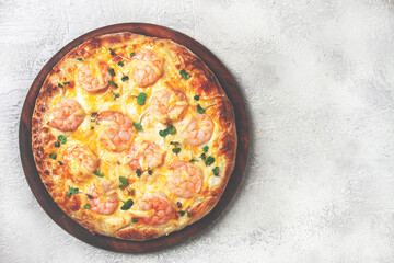 four cheese pizza with shrimp and fresh microgreens, served on a wooden board, homemade, no people,