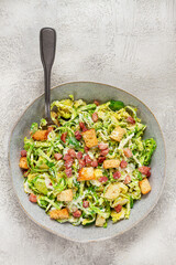 Brussels sprouts Caesar salad, with bacon and croutons, healthy food, homemade, no people,