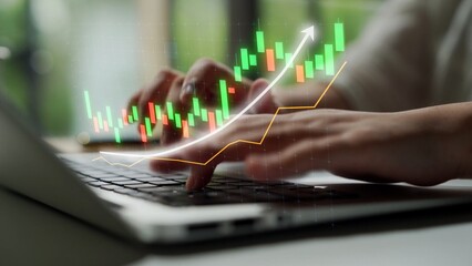Close-up of hands typing on a laptop with an overlay of stock market growth graph, illustrating financial trends and analysis in a modern workspace. Copula