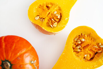 Autumn leaves and pumpkins flat lay on white background. Fall holidays, Thanksgiving, invitation, greeting card background template, top view with border copy space.