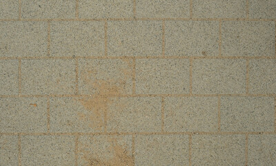 A brick wall with a few small holes in it