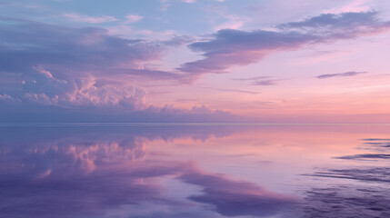Stunning Sunset Over Tranquil Water with Reflections and Pastel Hues

