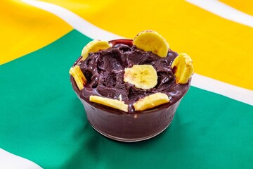 The most authentic Brazilian açaí, Euterpe oleracea, with banana in a minimalist bowl and compatible environment. Superfood energy and vitamins
