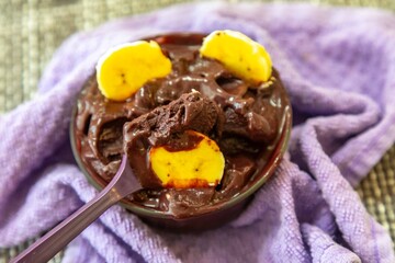 The most authentic Brazilian açaí, Euterpe oleracea, with banana in a minimalist bowl and compatible environment. Superfood energy and vitamins