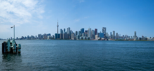 Naklejka premium Panorama of Toronto skyline seen from Toronto Islands across Lake Ontario, Canada