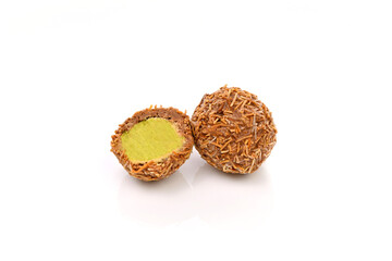 The Dubai chocolate candy is half eaten and the other half is still whole