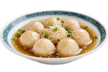 Traditional Chinese Tangyuan: Sweet Glutinous Rice Balls in Ginger Syrup, Garnished with Sesame and Scallions. Authentic Asian Dessert for Cultural Celebrations or Comforting Indulgence.
