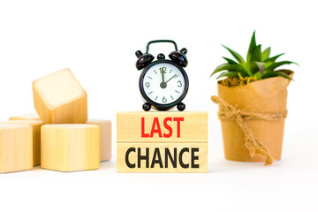 Last chance symbol. Concept word Last chance on beautiful wooden blocks. Beautiful white paper...