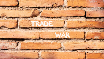 Trade war symbol. Concept word Trade war on beautiful old brown brick wall. Beautiful old brown...