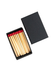 A black matchbox with wooden matches and red tips.  The box is open, revealing several matches inside