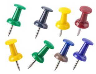 Assorted colored push pins, isolated on black