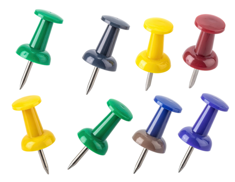 Assorted colored push pins, isolated on black