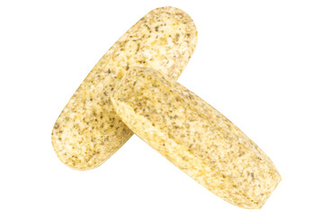 Garlic supplement pills on white background