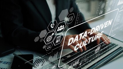 Professional Businessman Working on Laptop Emphasizing Data-Driven Culture and Technology Concepts in Modern Office Environment. Asymptotic smart data analytic.