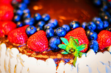 Close-up of Delicious Chocolate Cake Topped with Fresh Bright Berries