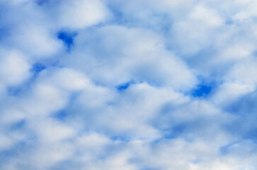 Bright Blue Sky Background with Soft White Puffy Cumulus Cloud Texture