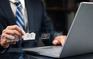E-library and E-learning Concept, Person using laptop with virtual E-Book icons for online knowledge Base, Digital library, Access electronic books on Internet. Course education. Webinar technology.