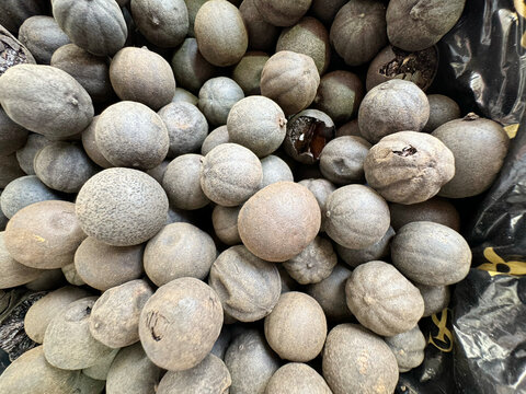 Close-up of Whole Dried Black Limes (Loomi) in a Spice Market