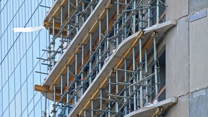 Unfinished Multi Storey Residential Building Construction Site with Metal Scaffolding