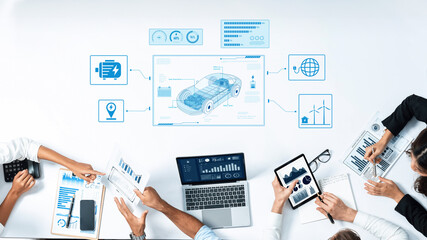 A team collaborates on data analysis and visualization related to the automotive industry, utilizing various digital tools in a modern office environment. Trope