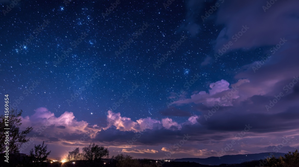 Wall mural the sky is filled with clouds and stars, creating a serene and tranquil atmosphere. the clouds are s