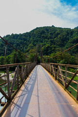 Obraz premium Shot of the suspension bridge in the mountains. Objects