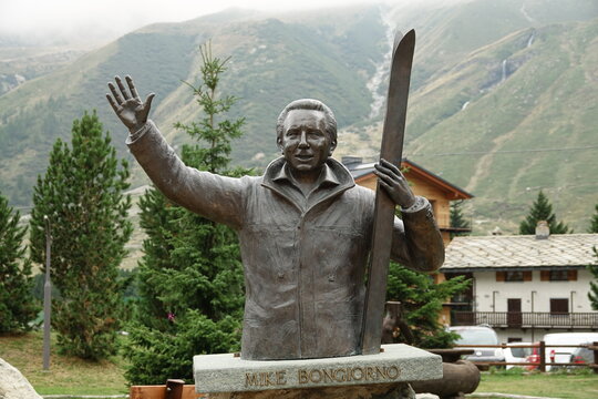 bronze statue dedicated to Mike Bongiorno in Cervinia village. Breuil-Cervinia, Valtournenche, Aosta Valley, Italy - 08.17.2022