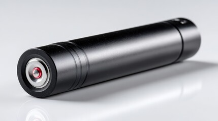 Compact black cylindrical device with sleek design and smooth finish