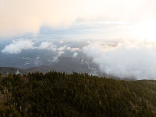 Fototapeta premium Aerial View of Clouds Rolling over the Black Mountains in North Carolina at Sunrise