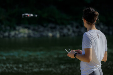 A young drone pilot learns to accurately monitor bodies of water in nature using a drone with built-in RTK