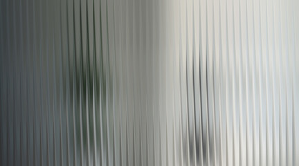 Abstract vertical ribbed glass with soft light and shadow © fatima