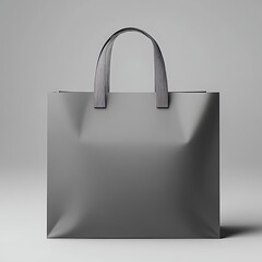 Minimalistic gray shopping bag on a smooth surface.
