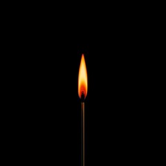 Close-up of a single matchstick burning brightly against a stark, black background