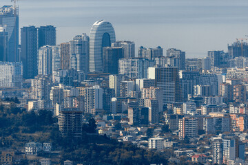 Obraz premium Panorama of Batumi from the mountains. Aerial view. The central part of Batumi. Skyscrapers and buildings