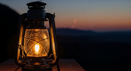 An old lantern glowing warmly during sunset outdoors.